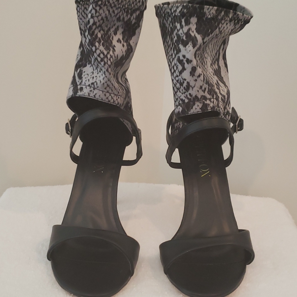 Open toe heel shoes.